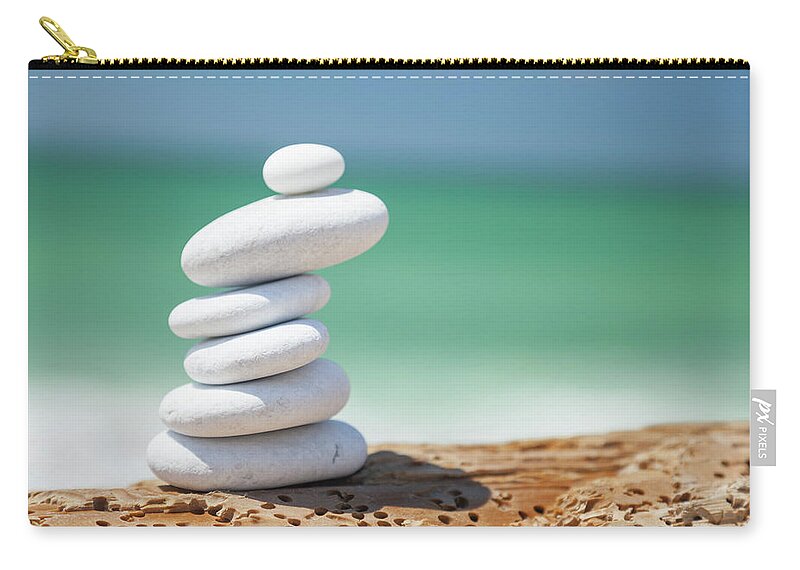 Toughness Zip Pouch featuring the photograph Pebbles At The Beach by Focusstock