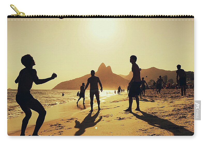 Outdoors Zip Pouch featuring the photograph People Playing Football At Ipanema by Alexander Spatari