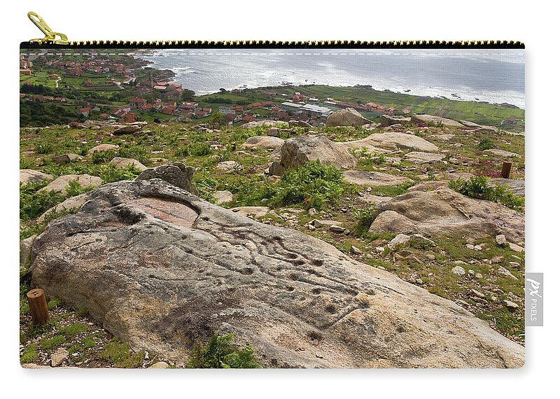 Greek Culture Zip Pouch featuring the photograph Petroglyph Of Pedreira In Oia by By Lansbricae (luis Leclere)