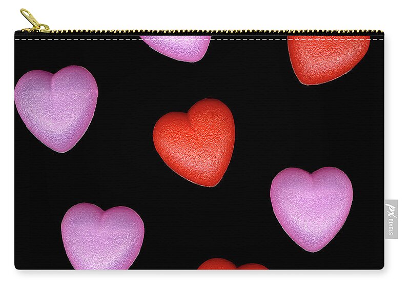 Black Background Zip Pouch featuring the photograph Plastic Hearts by Thomas J Peterson