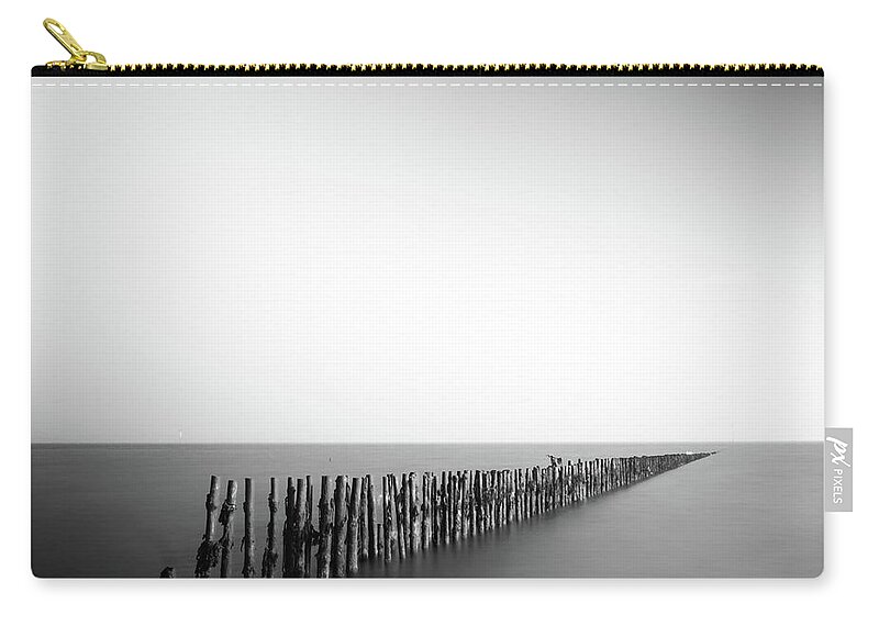 Pole Zip Pouch featuring the photograph Posts In Sea by Anthony Skelton