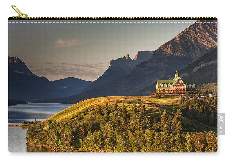 Prince Of Wales Hotel Zip Pouch featuring the photograph Prince of Wales Sunrise by Mark Kiver
