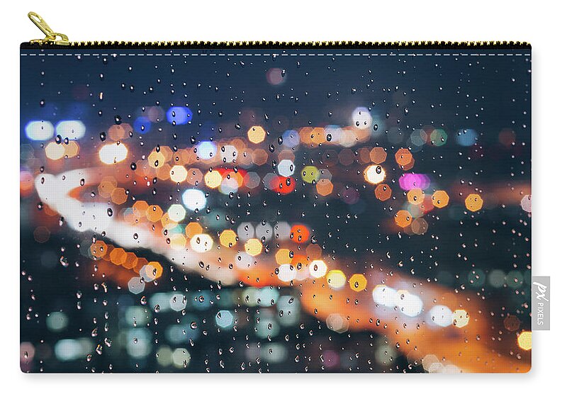 Tranquility Zip Pouch featuring the photograph Rainy Day Window With Defocused Lights by Miragec
