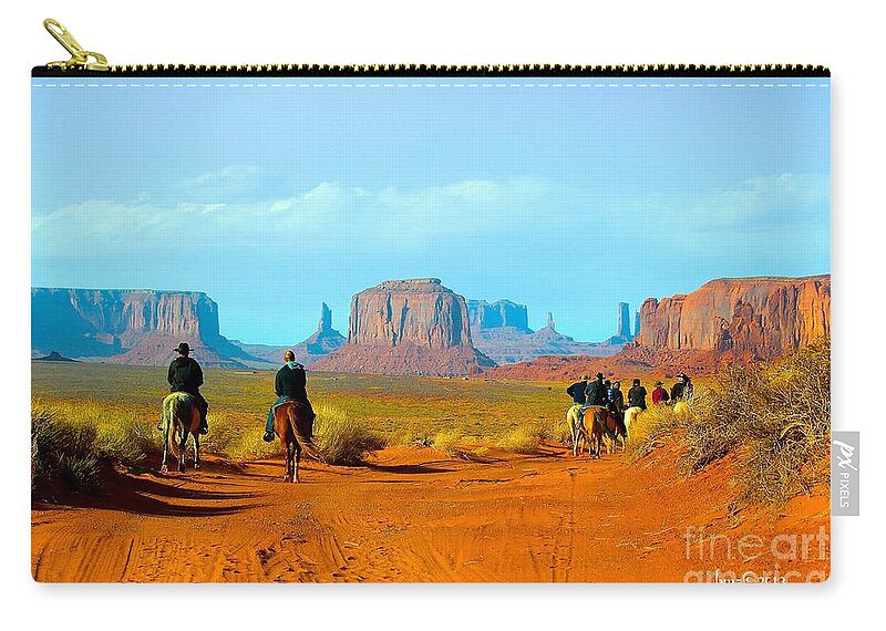 Monument Valley Zip Pouch featuring the photograph Riders at Monument Valley by Barbara Zahno