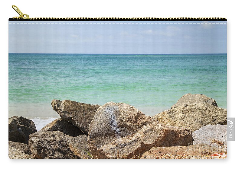 Indian Ocean Zip Pouch featuring the photograph rocks in front of the Indian Ocean by Gina Koch