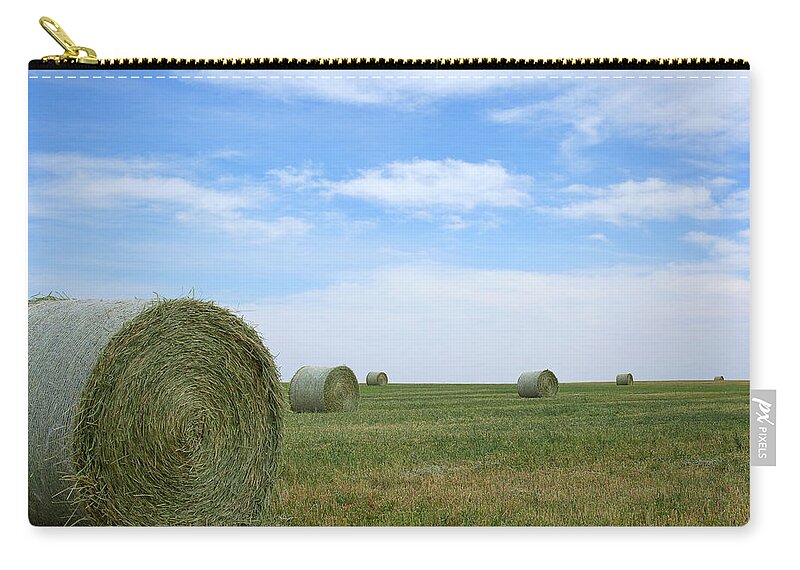 Hay Bales Photograph Zip Pouch featuring the photograph Rollin' Rollin' Rollin' by Jim Garrison