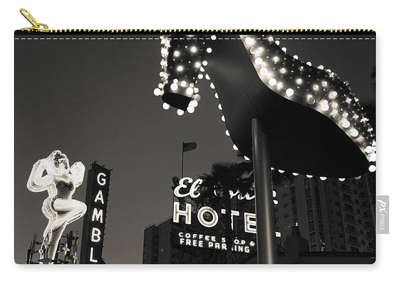 Photography Zip Pouch featuring the photograph Ruby Slipper Neon Sign Lit Up At Dusk by Panoramic Images