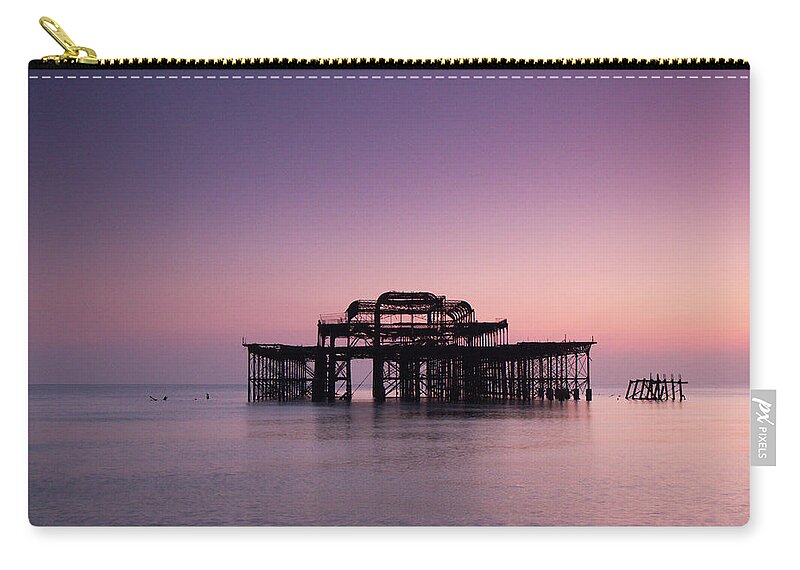 Scenics Zip Pouch featuring the photograph Ruins Of West Pier by Lucie Averill