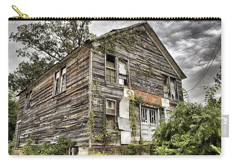 Rustic Zip Pouch featuring the photograph Saddle Store 1 of 3 by Jason Politte