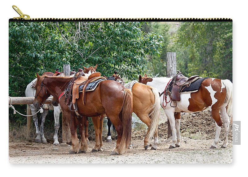 Horses Zip Pouch featuring the photograph Saddled by Athena Mckinzie