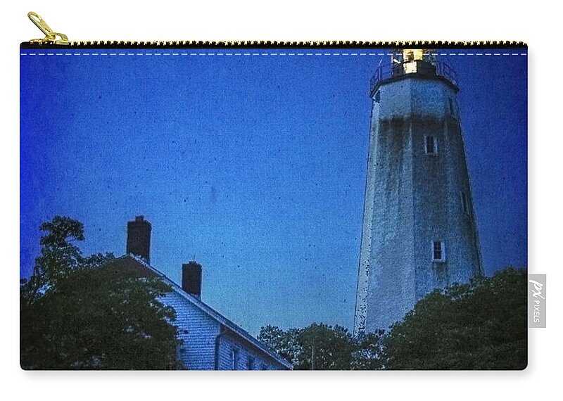 Lighthouse Zip Pouch featuring the photograph Sandy Hook Lighthouse at Twilight by Debra Fedchin