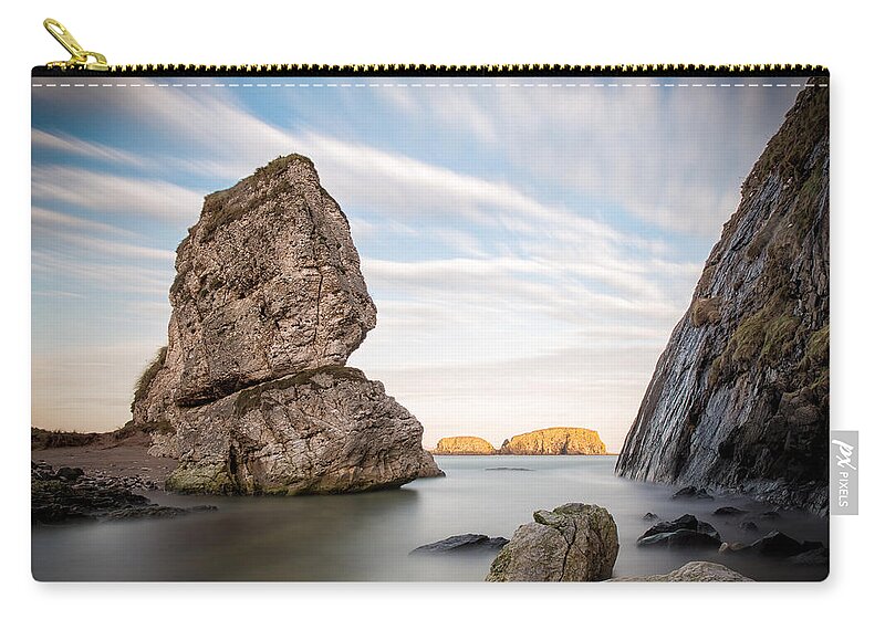 Sheep Island Zip Pouch featuring the photograph Sheep Island - Ballintoy by Nigel R Bell