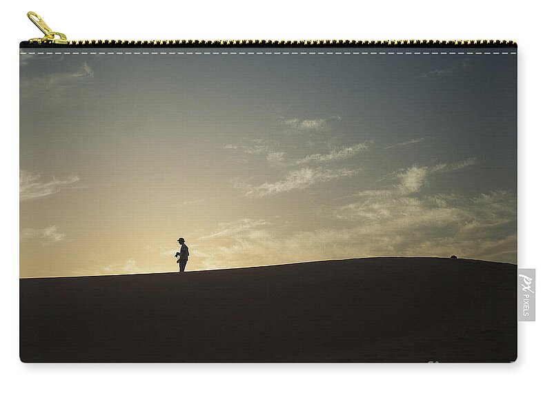 Sahara Zip Pouch featuring the photograph Silhouette in the Sahara by Patricia Hofmeester