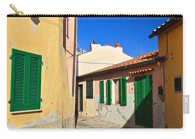 Capoliveri Zip Pouch featuring the photograph small street in Capoliveri by Antonio Scarpi