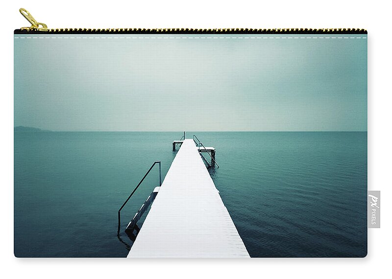 Tranquility Zip Pouch featuring the photograph Snow Covered Jetty by Daitozen