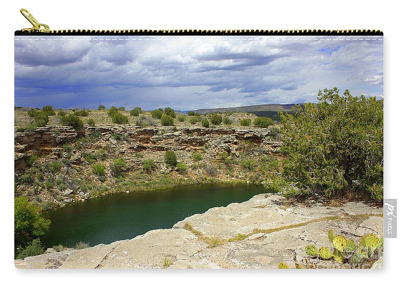 Verde Valley Zip Pouch featuring the photograph Storm Clouds over Montezuma Well by Carol Groenen
