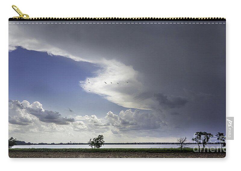 Overholser Lake Zip Pouch featuring the photograph Storm over the lake by Betty LaRue