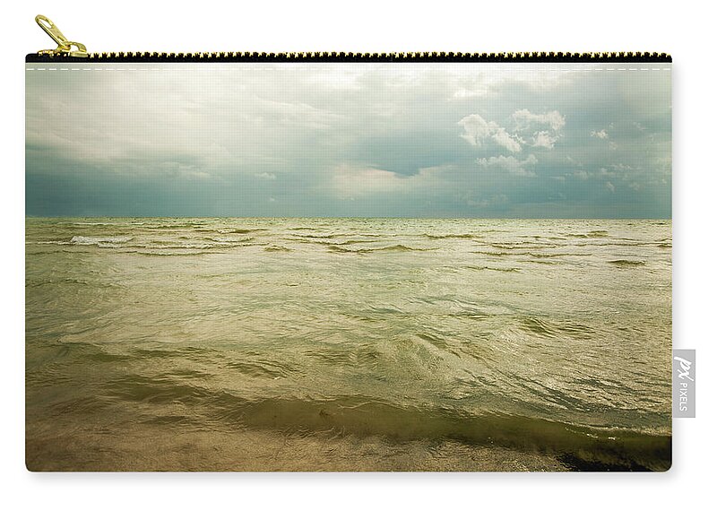 Scenics Zip Pouch featuring the photograph Stormy Water Landscape by Marlene Ford