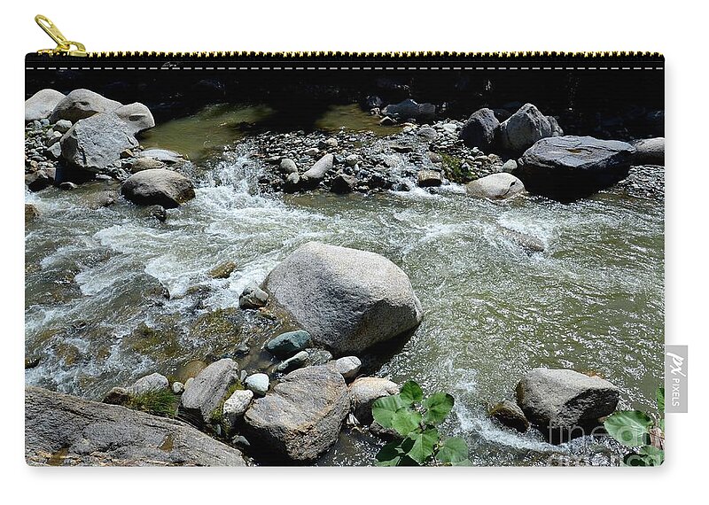 Blue Zip Pouch featuring the photograph Stream water foams and rushes past boulders by Imran Ahmed
