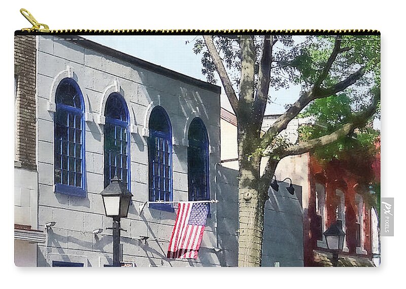 Alexandria Zip Pouch featuring the photograph Alexandria VA - Street With American Flag by Susan Savad