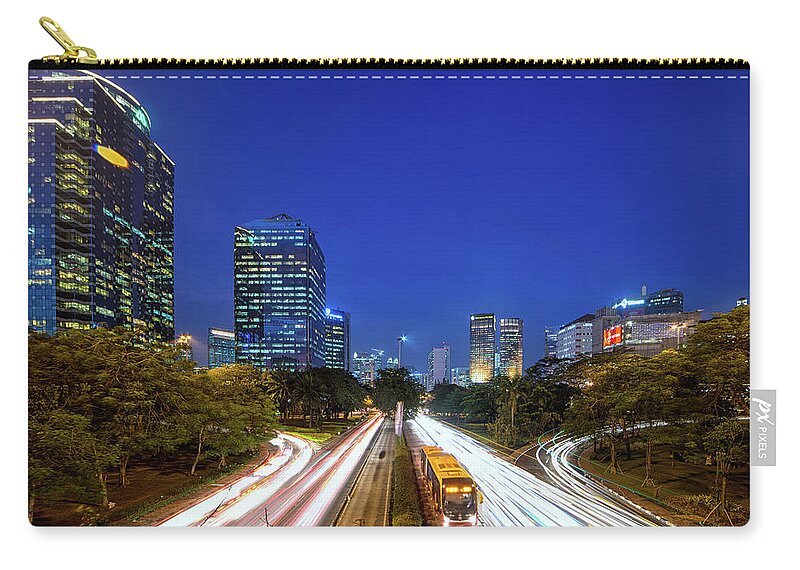 Tranquility Zip Pouch featuring the photograph Sudirman Blue Hour by Abdul Azis