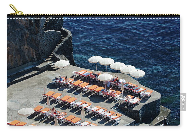 In A Row Zip Pouch featuring the photograph Sun Deck On The Rocks, Near Positano by Dallas Stribley