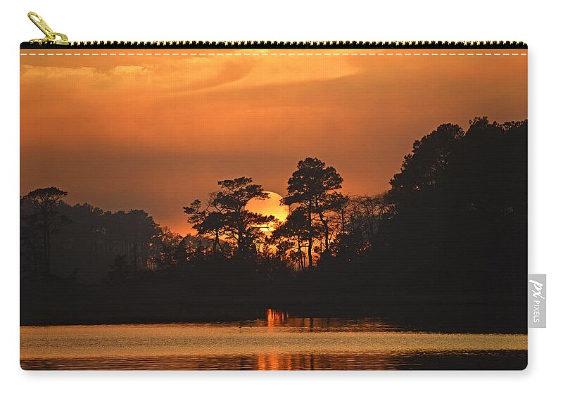 Sunset Zip Pouch featuring the photograph Sun Setting in Trees by Bill Swartwout