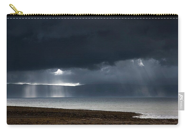 Scotland Zip Pouch featuring the photograph Sunbeams Shine Through Dark Storm by John Short / Design Pics