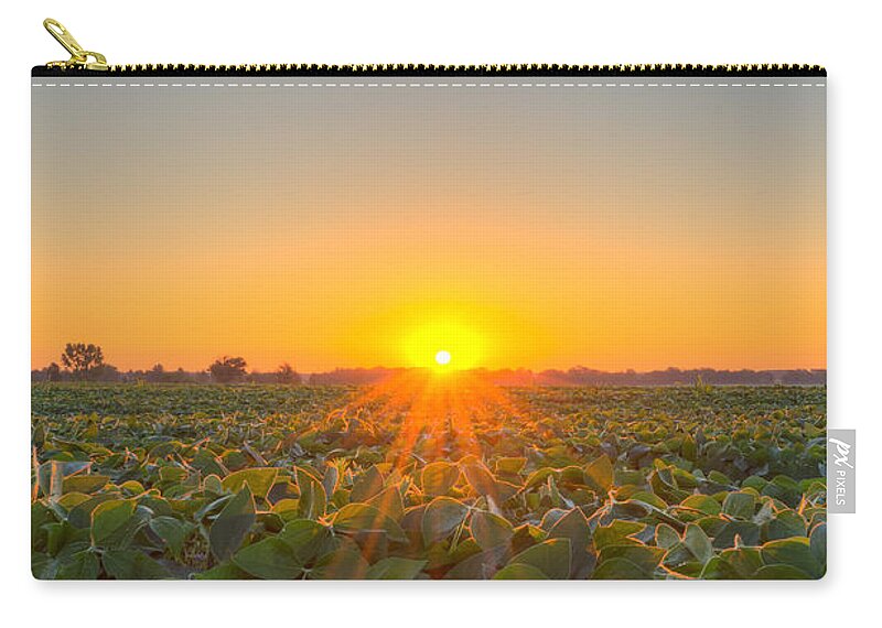 Michael Versprill Zip Pouch featuring the photograph Sunrise over a field by Michael Ver Sprill