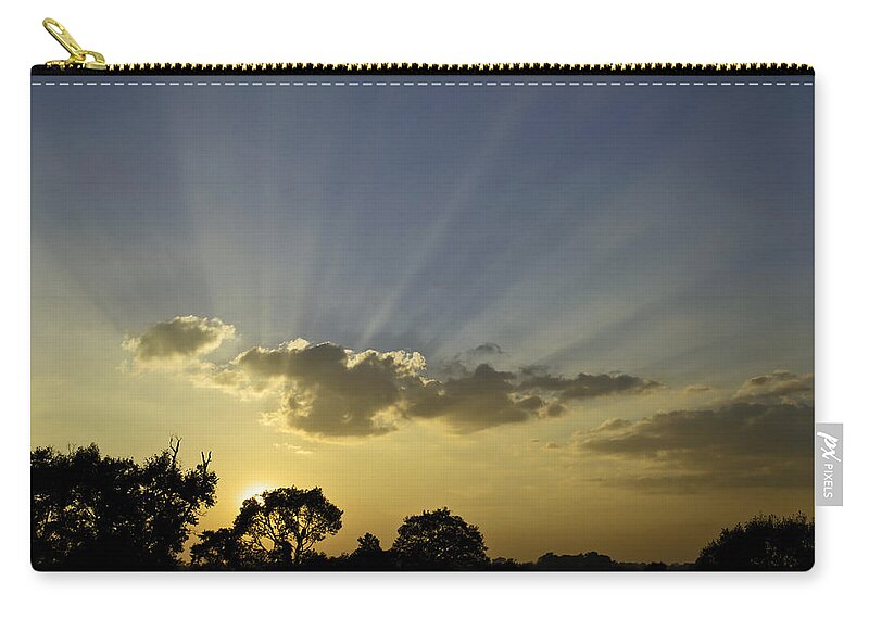 Sunset Zip Pouch featuring the photograph Sunset sunrays by David Freuthal