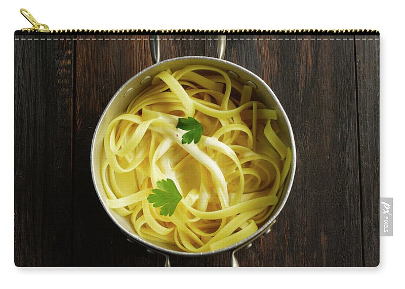 Italian Food Zip Pouch featuring the photograph Tagliatelle In Pot On Table by Westend61
