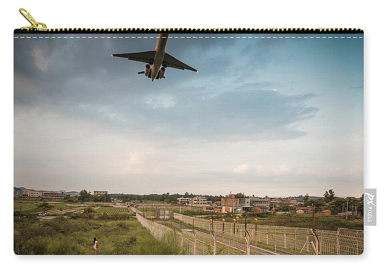 Tranquility Zip Pouch featuring the photograph The Airplane On Final Approach, China by Capturing A Second In Life, Copyright Leonardo Correa Luna