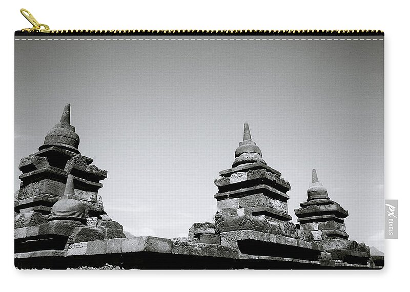 Borobudur Zip Pouch featuring the photograph The Ancient Stupas Of Borobudur by Shaun Higson