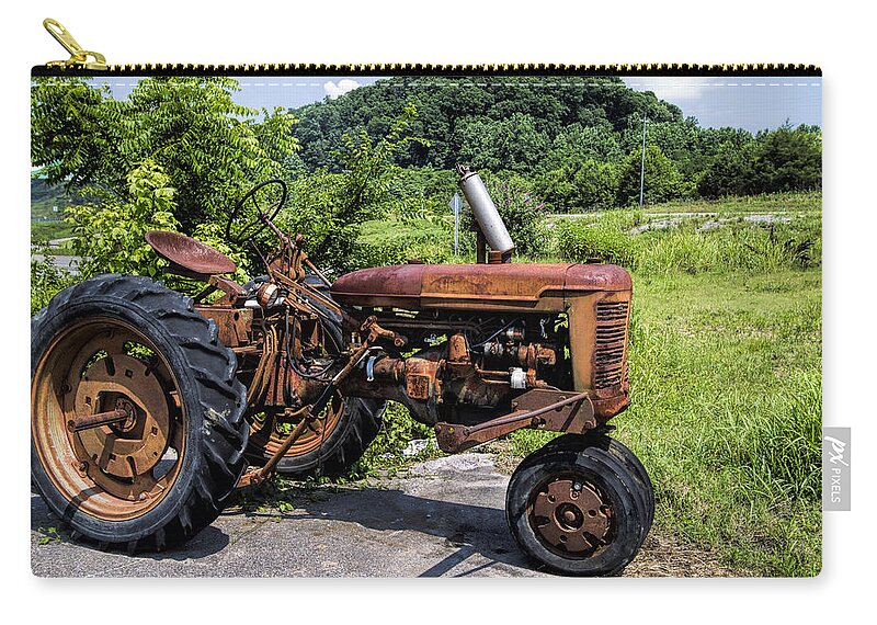 Tractor Zip Pouch featuring the photograph The Ghost of Farming Past by Kathy Clark