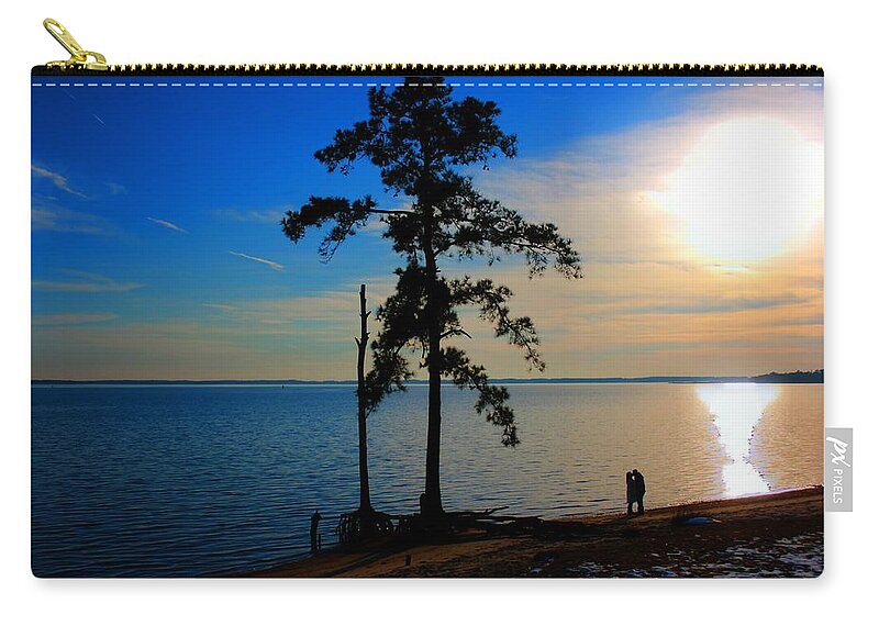 Silhouette Zip Pouch featuring the photograph The Kiss by Dan Stone