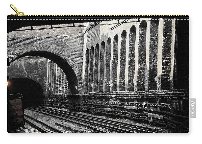 The London Underground Zip Pouch featuring the photograph The London Underground by Zinvolle Art