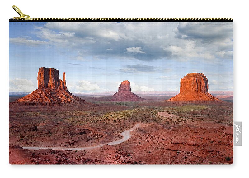 Arizona Zip Pouch featuring the photograph The Mittens and Merrick Butte at Sunset by Jeff Goulden
