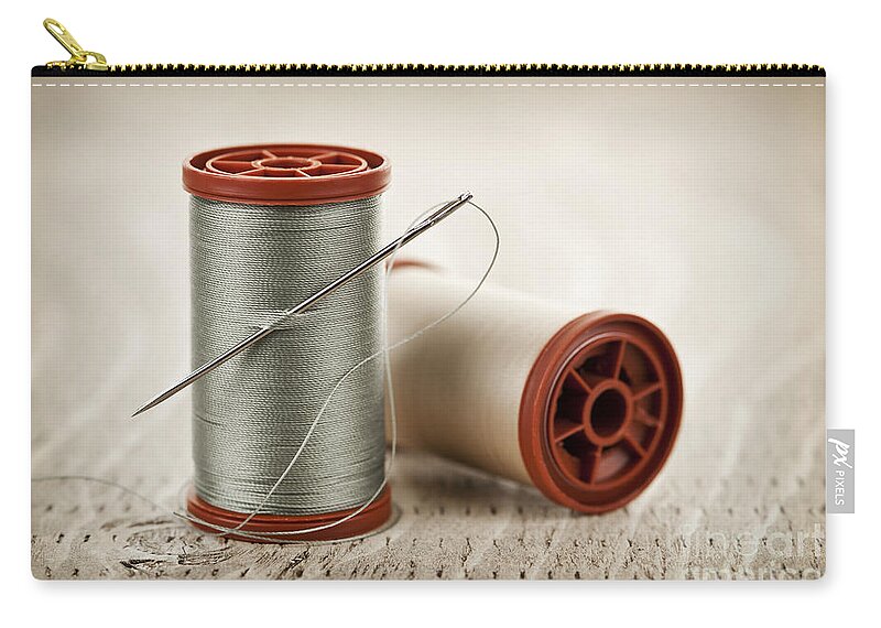 Thread Zip Pouch featuring the photograph Thread and needle 2 by Elena Elisseeva