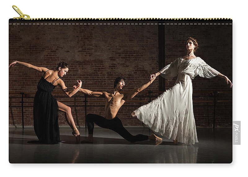 Young Men Zip Pouch featuring the photograph Three Ballet Dancers Performing Together by Nisian Hughes