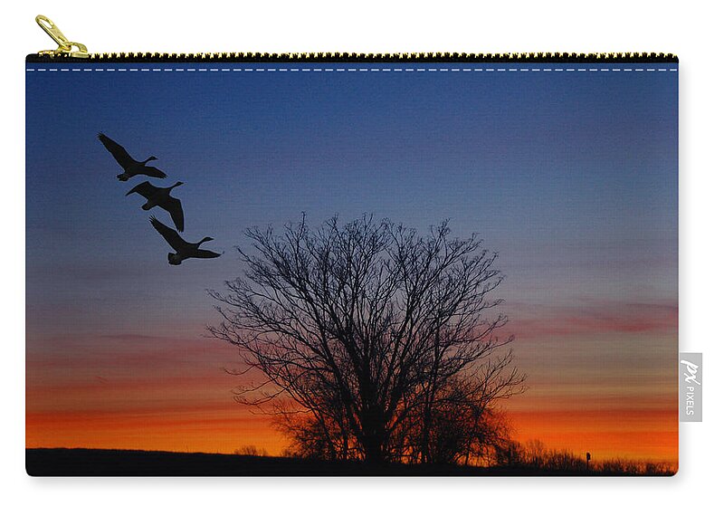 Three Geese At Sunset Zip Pouch featuring the photograph Three Geese at Sunset by Raymond Salani III