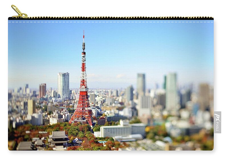 Tokyo Tower Zip Pouch featuring the photograph Tokyo Tower In Focus by Vladimir Zakharov