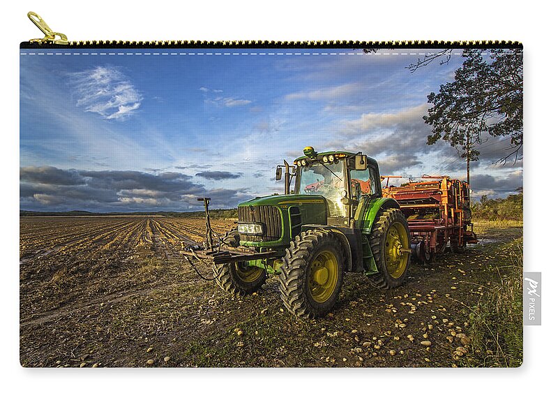 Potato Farm Zip Pouch featuring the photograph Tractor on a Potato Farm by Robert Seifert