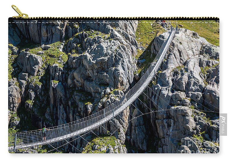 Triftsee Bridge Zip Pouch featuring the photograph Triftsee Suspension Bridge - Swiss Alps by Gary Whitton