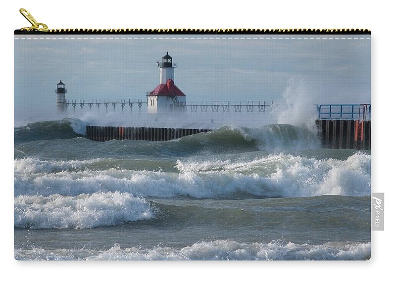 Wind Zip Pouch featuring the photograph Tumultuous Lake by Ann Horn
