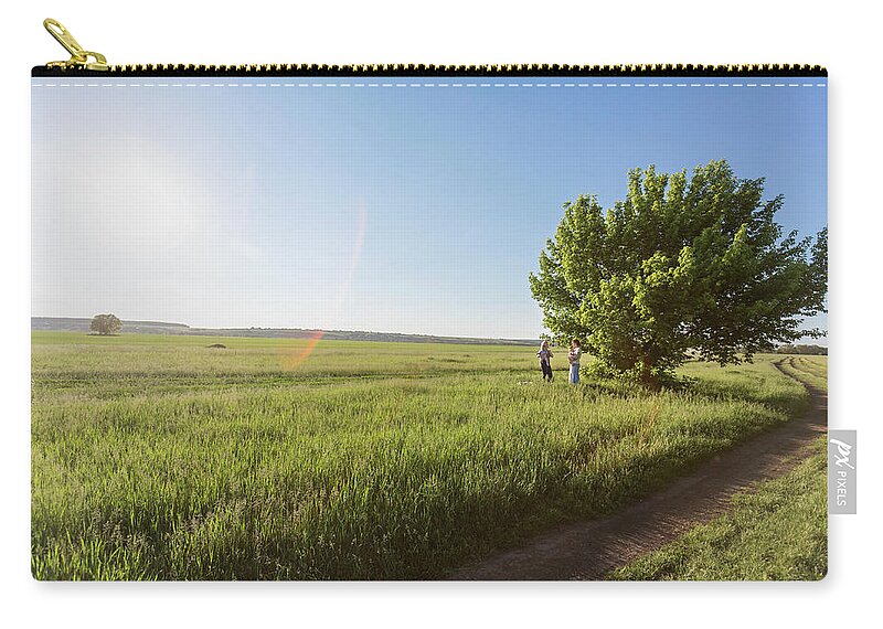 Mature Adult Zip Pouch featuring the photograph Two Mothers Holding Their Babies While by Vladimir Godnik