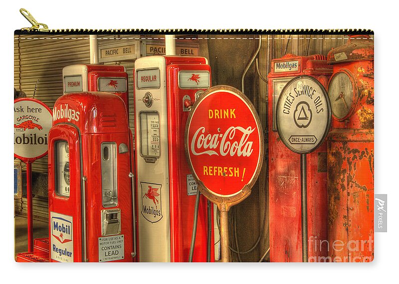 Antiques Zip Pouch featuring the photograph Vintage Gasoline Pumps With Coca Cola Sign by Bob Christopher