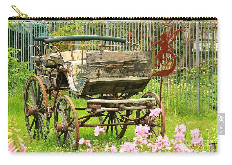 Aged Carry-all Pouch featuring the photograph Vintage horse carriage in a flower bed by Amanda Mohler