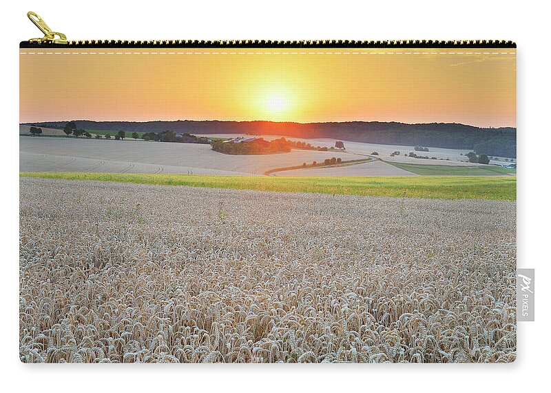 Outdoors Zip Pouch featuring the photograph Wheat Field At Sunset by Raimund Linke