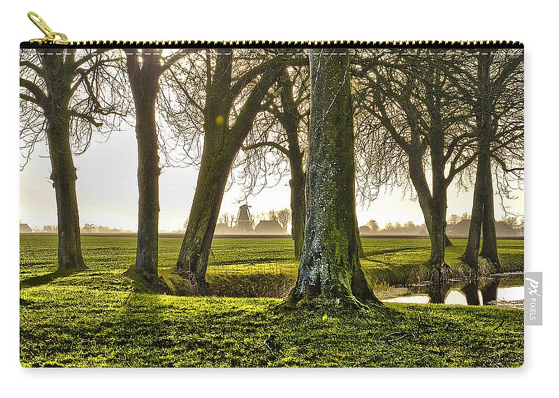 Netherlands Zip Pouch featuring the photograph Windmill And Trees In Groningen by Frans Blok