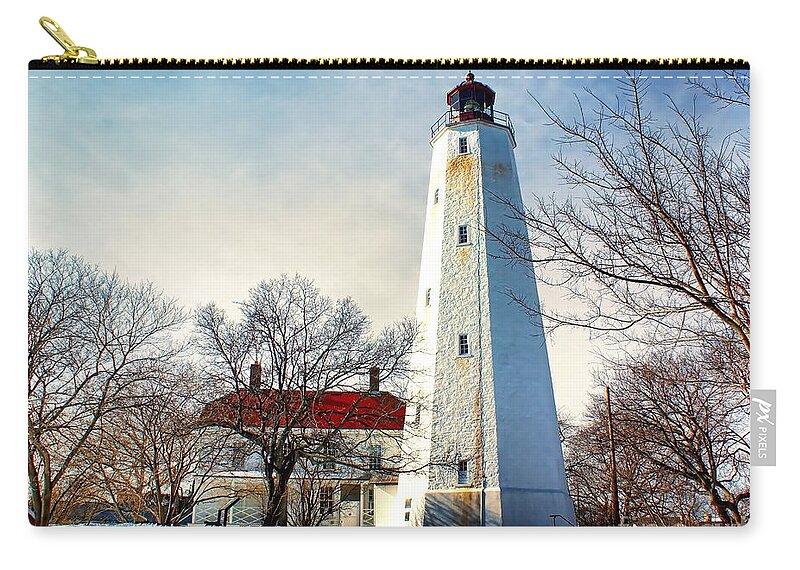 Architecture Zip Pouch featuring the photograph Winter at Sandy Hook Light by Nick Zelinsky Jr